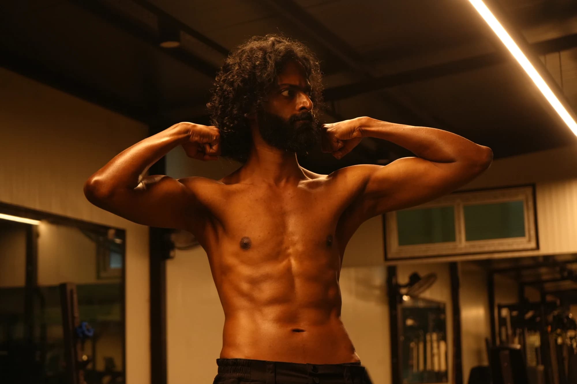 Rohith posing during a fitness photoshoot